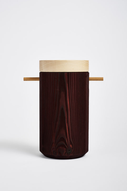 Brown colored wooden urn displays on a white background.